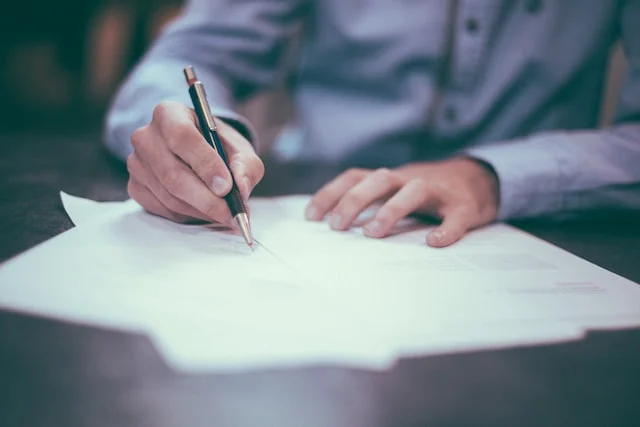 Mechatronic engineering fresh graduate signing a document.